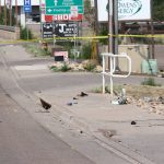 This Saturday, June 19, 2021, photo courtesy of The White Mountain Independent shows the scene of an accident after a pick up truck ran over a group of cyclists in Show Low, Ariz. A driver in a pickup truck plowed into bicyclists competing in a community road race in Arizona on Saturday, critically injuring several riders before police chased down the driver and shot him outside a nearby hardware store, police said. (Jim Headley/The White Mountain Independent via AP)