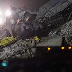 
              Rescue workers remove a body from the rubble where a wing of a 12-story beachfront condo building collapsed, Thursday, June 24, 2021, in the Surfside area of Miami.(AP Photo/Gerald Herbert)
            