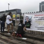 
              Family of Ricardo Valdes, who disappeared on the road on May 25,   put up posters with their photography during a protest in Monterrey, Nuevo Leon state, Mexico, Thursday, June 24, 2021. As many as 50 people in Mexico are missing after they set off on simple highway trips between the industrial hub of Monterrey and the border city of Nuevo Laredo; relatives say they simply disappeared on the heavily traveled road, which has been dubbed 'the highway of death,' never to be seen again. (AP Photo/Roberto Martinez)
            