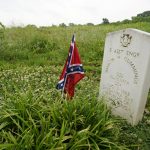 
              A headstone marks the grave of Simeon Cummings on the grounds of the National Confederate Museum on June 6, 2021, in Columbia, Tenn. Cummings is the currently the only Confederate soldier buried at the museum. With the approval of relatives, the remains of Confederate Gen. Nathan Bedford Forrest will be moved from Memphis, Tenn., to the museum. (AP Photo/Mark Humphrey)
            