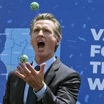 
              California Gov. Gavin Newsom juggles balls with winning numbers after the Vax for the Win lottery contest during a news conference at Universal Studios in Universal City, Calif., Tuesday, June 15, 2021. On Tuesday, California lifted most of its COVID-19 restrictions and ushered in what has been billed as the state’s “Grand Reopening.” (AP Photo/Ringo H.W. Chiu)
            