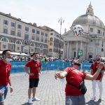 
              Turkish supporters play with a soccer ball in Rome's Piazza del Popolo hours before the start of the Euro 2020 soccer championship group A match between Italy and Turkey, at the Rome Olympic stadium Friday, June 11, 2021. Postponed by a year, the biggest sports event since the coronavirus brought the world to a halt kicks off Friday at Rome’s Stadio Olimpico, a milestone both for Europe and global sports.  (AP Photo/Riccardo De Luca)
            