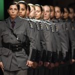 
              FILE - In this May 9, 2017, file photo, New York State Police line up to receive their diplomas during a graduation ceremony at the Empire State Plaza Convention Center in Albany, N.Y. The New York State Police agency remains overwhelmingly white, an imbalance some troopers say is rooted in a legacy of racism. (AP Photo/Hans Pennink, File)
            