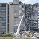 
              Crews work in the rubble at the Champlain Towers South Condo, Sunday, June 27, 2021, in Surfside, Fla. Many people are still unaccounted for after Thursday's fatal collapse. (AP Photo/Wilfredo Lee)
            