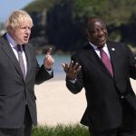 
              British Prime Minister Boris Johnson, left greets South African President Cyril Ramaphosa during arrivals for the G7 meeting at the Carbis Bay Hotel in Carbis Bay, St. Ives, Cornwall, England, Saturday, June 12, 2021. Leaders of the G7 gather for a second day of meetings on Saturday, in which they will discuss COVID-19, climate, foreign policy and the economy. (AP Photo/Kirsty Wigglesworth, Pool)
            