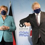 
              Britain's Prime Minister Boris Johnson, right, greets German Chancellor Angela Merkel ahead of a bilateral meeting during the G7 summit in Cornwall, England, Saturday June 12, 2021. (Stefan Rousseau/Pool via AP)
            