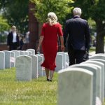 
              President Joe Biden walks with first lady Jill Biden as they visit section 12 at Arlington National Cemetery, Monday, May 31, 2021, in Arlington, Va.(AP Photo/Alex Brandon)
            
