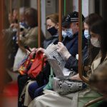 
              People wearing face mask to help curb the spread of the coronavirus ride a subway car in Moscow, Russia, Thursday, June 10, 2021. The Russian authorities reported a spike in coronavirus infections on Thursday, with new confirmed cases exceeding 11,000 for the first time since March. (AP Photo/Alexander Zemlianichenko)
            