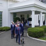 
              President Joe Biden walks out of the White House with Senators to speak Thursday, June 24, 2021, in Washington. (AP Photo/Evan Vucci)
            
