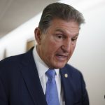 
              Sen. Joe Manchin, D-W.Va., chairman of the Senate Energy and Natural Resources Committee, talks to reporters as he arrives for a hearing on infrastructure needs of the U.S. energy sector, western water and public lands, at the Capitol in Washington, Wednesday, June 23, 2021. Manchin and other Senate infrastructure negotiators are meeting with President Joe Biden at the White House later today. (AP Photo/J. Scott Applewhite)
            