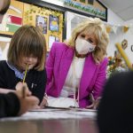 
              US First Lady Jill Biden talks with children in the school's Reception Class during a visit to Connor Downs Academy in Hayle, West Cornwall, during the G7 summit in England, Friday, June 11, 2021. (Aaron Chown/Pool photo via AP)
            