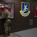 
              In this June 17, 2020, photo made available by the U.S. Air Force, a member of security forces stands at the 316th Security Support Squadron armory window to receive weapons and equipment for his shift at Joint Base Andrews, Md. Using government records covering the Army, Marines, Navy and Air Force, an Associated Press investigation showed that military pistols, machine guns, shotguns and assault rifles vanished from armories, supply warehouses, Navy warships, firing ranges and other places where they were used, stored or transported. (Senior Airman Kaylea Berry/U.S. Air Force via AP)
            