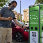 
              A man charges his electric car at an electrical charging point in Rivas Vaciamadrid, Spain, Tuesday, June 15, 2021.  Spain is Europe's second-leading car maker but it is lagging behind when it comes to electric cars, a situation that the government aims to change by using around five billion euros of the EU pandemic recovery funds to kickstart the electric car industry. The government plans to spend big, to install a network of public recharging stations and to convince customers about the benefits of buying electric or hybrid vehicles. (AP Photo/Manu Fernandez)
            