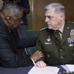
              Secretary of Defense Lloyd Austin, left, and Chairman of the Joint Chiefs Chairman Gen. Mark Milley talk before a Senate Appropriations Committee hearing to examine proposed budget estimates and justification for fiscal year 2022 for the Department of Defense in Washington on Thursday, June 17, 2021. (Evelyn Hockstein/Pool via AP)
            