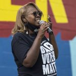 
              LaTosha Brown, co-founder of Black Voters Matter, speaks on voting rights at the John Lewis Advancement Act Day of Action, a voter education and engagement event, Saturday, May 8, 2021, at King's Canvas in Montgomery, Ala. (AP Photo/Vasha Hunt)
            