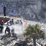 
              Crews cut through concrete as they work in the rubble at the Champlain Towers South Condo, Sunday, June 27, 2021, in Surfside, Fla. Many people are still unaccounted for after Thursday's fatal collapse. (AP Photo/Wilfredo Lee)
            