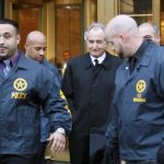 
              FILE - Disgraced financier Bernard Madoff, center, leaves U.S. District Court in Manhattan escorted by U.S. Marshals after a bail hearing in New York, Monday, Jan. 5, 2009. More than 12 years after Madoff confessed to running the biggest financial fraud in Wall Street history, a team of lawyers is still at work on a sprawling effort to recover money for the thousands of victims of his scam.  (AP Photo/Kathy Willens, File)
            