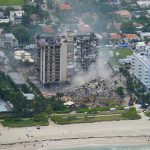 
              Rescue personnel work in the rubble at the Champlain Towers South Condo, Friday, June 25, 2021, in Surfside. The seaside condominium building partially collapsed on Thursday. (AP Photo/Gerald Herbert)
            