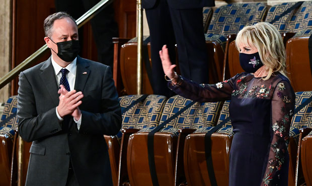 U.S. second gentleman Doug Emhoff (L) and U.S. first lady Dr. Jill Biden (R) arrive before a speech...