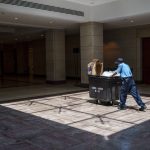 
              In this June 29, 2021, photo a work walks in the empty U.S. Capitol Visitor Center, closed since the COVID-19 shutdown in early 2020, is seen at the Capitol in Washington. (AP Photo/J. Scott Applewhite)
            