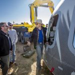 
              In this undated photo made available by Blue Origin, Jeff Bezos, center, and others inspect Crew Capsule 2.0 after touchdown in West Texas. When Blue Origin launches people into space for the first time, Bezos will be on board. No test pilots or flight engineers for the Tuesday, July 20, 2021 debut flight from West Texas - just Bezos, his brother, an 82-year-old aviation pioneer and a teenager. (Blue Origin via AP)
            