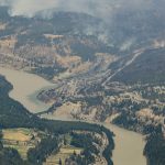 
              In this aerial photo taken from a helicopter, a wildfire burns in the mountains north of Lytton, British Columbia, on Thursday, July 1, 2021. A wildfire that forced people to flee a small town in British Columbia that had set record high temperatures for Canada on three consecutive days burned out of control Thursday as relatives desperately sought information on evacuees. (Darryl Dyck/The Canadian Press via AP)
            
