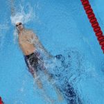 
              Evgeny Rylov, of the Russian Olympic Committee, swims to victory in the men's 200m backstroke final at the 2020 Summer Olympics, Friday, July 30, 2021, in Tokyo, Japan. (AP Photo/Jeff Roberson)
            