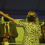 
              First lady of the United States Jill Biden waves during the opening ceremony in the Olympic Stadium at the 2020 Summer Olympics, Friday, July 23, 2021, in Tokyo, Japan. (Dylan Martinez/Pool Photo via AP)
            