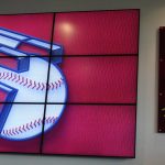 
              The new Cleveland Indians logo is displayed on a screen next to art work, Friday, July 23, 2021, in Cleveland. Known as the Indians since 1915, Cleveland's Major League Baseball team will be called Guardians. The ballclub announced the name change Friday, effective at the end of the 2021 season. (AP Photo/Tony Dejak)
            
