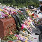 
              Citizens lay bouquets of flowers at the Fatherland Liberation War Martyrs Cemetery in Pyongyang, North Korea, Tuesday, July 27, 2021, to mark the Korean War armistice anniversary. The leaders of North and South Korea restored suspended communication channels between them and agreed to improve ties, both governments said Tuesday, amid a 2 ½ year-stalemate in U.S.-led diplomacy aimed at stripping North Korea of its nuclear weapons. (AP Photo/Jon Chol Jin)
            