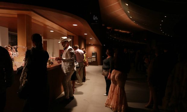 An opera attendee gets cucumber water during intermission at the opening show of the Santa Fe Opera...