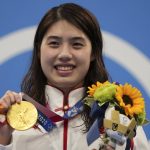 
              Zhang Yufei of China poses with her gold medal after winning the women's 200-meter butterfly final at the 2020 Summer Olympics, Thursday, July 29, 2021, in Tokyo, Japan. (AP Photo/Matthias Schrader)
            