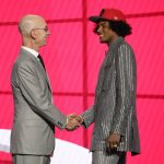 
              NBA Commissioner Adam Silver greets Jalen Green after he was selected by the Houston Rockets as the second pick during the first round of the NBA basketball draft, Thursday, July 29, 2021, in New York. (AP Photo/Corey Sipkin)
            