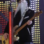 
              FILE - Dusty Hill of ZZ Top performs during the VH1 Rock Honors concert in Las Vegas on May 12, 2007. ZZ Top has announced that Hill, one of the Texas blues trio's bearded figures and bassist, has died at his Houston home. He was 72. In a Facebook post, bandmates Billy Gibbons and Frank Beard revealed Wednesday, July 28, 2021, that Hill had died in his sleep. (AP Photo/Jae C. Hong, File)
            