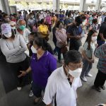 
              Residents wait on line to receive shots of the AstraZeneca COVID-19 vaccine at the Central Vaccination Center in Bangkok, Thailand, Thursday, July 22, 2021. (AP Photo/Sakchai Lalit)
            