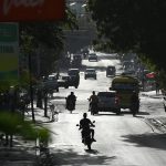 
              People drive on a main road in Port-au-Prince, Haiti, Saturday, July 10, 2021, three days after President Jovenel Moise was assassinated in his home. (AP Photo / Matias Delacroix)
            