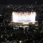 
              Fireworks illuminate over the National Stadium during the opening ceremony of 2020 Tokyo Olympics views from Shibuya Sky observation deck Friday, July 23, 2021, in Tokyo, Japan. (AP Photo/Eugene Hoshiko)
            