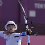 
              South Korea's An San releases an arrow during the mixed team competition at the 2020 Summer Olympics, Saturday, July 24, 2021, in Tokyo, Japan. (AP Photo/Alessandra Tarantino)
            