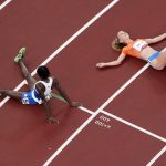 
              Alex Rose, of Samoa, and Diane Van Es, of Netherlands, colapse after competing during the first round of the women's 5,000-meter at the 2020 Summer Olympics, Friday, July 30, 2021, in Tokyo. (AP Photo/Morry Gash)
            