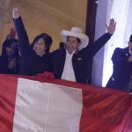 
              Pedro Castillo, center, celebrates with his running mate Dina Boluarte after being declared president-elect of Peru by election authorities, at his party´s campaign headquarters in Lima Peru, Monday, July 19, 2021. Castillo was declared president-elect more than a month after the elections took place and after opponent Keiko Fujimori claimed that the election was tainted by fraud. (AP Photo/Guadalupe Prado)
            
