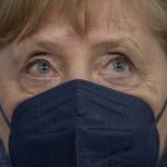 
              German Chancellor Angela Merkel  stands up with mask after the press conference following her visit to the Robert Koch Institute (RKI) in Berlin, Germany, Tuesday, July 13, 2021. Merkel visited the health ministry's leading institute in the Corona pandemic at the invitation of Health Minister Spahn. (Michael Kappeler/Pool via AP)
            