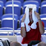 
              Daniil Medvedev, of the Russian Olympic Committee, cools off during a changeover in a tennis match against Alexander Bublik, of Kazakhstan, during at the 2020 Summer Olympics, Saturday, July 24, 2021, in Tokyo, Japan. (AP Photo/Patrick Semansky)
            