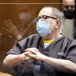 
              Harvey Weinstein, the 69-year-old convicted rapist and disgraced movie mogul, wears a face mask as he listens in court during a pre-trial hearing in Los Angeles, Thursday, 29 July 2021. Weinstein pleaded not guilty Wednesday to four counts of rape and seven other sexual assault counts in California.(Etienne Laurent/Pool Photo via AP)
            