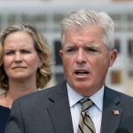 
              Suffolk County Executive Steve Bellone, right, speaks at a news conference to discuss a settlement in an opioid trial, Tuesday, July 20, 2021, in Central Islip, N.Y. Nassau County Executive Laura Curran is behind him. New York State reached an agreement Tuesday with the distribution companies AmerisourceBergen, Cardinal Health and McKesson to settle an ongoing trial. That deal alone would generate more than $1 billion to abate the damage done by opioids there. The trial is expected to continue, but the settlement leaves only three drug manufacturers as defendants. (AP Photo/Mark Lennihan)
            