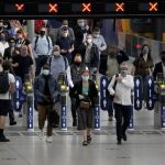 
              People wear face masks to curb the spread of coronavirus during the morning rush hour at Waterloo train station in London, Wednesday, July 14, 2021. (AP Photo/Matt Dunham)
            