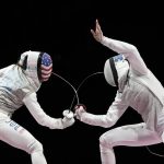 
              Inna Deriglazova of the Russian Olympic Committee, right, and Lee Kiefer of the United States compete in the women's individual Foil final competition at the 2020 Summer Olympics, Sunday, July 25, 2021, in Chiba, Japan. (AP Photo/Hassan Ammar)
            