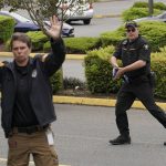 
              Andrew Thomas, right, of the King Co. Sheriff's Dept. takes part in a training exercise at the Washington state Criminal Justice Training Commission, Wednesday, July 14, 2021, in Burien, Wash. Washington state is embarking on a massive experiment in police reform and accountability following the racial justice protests that erupted after George Floyd's murder last year, with nearly a dozen new laws that took effect Sunday, July 25, but law enforcement officials remain uncertain about what they require in how officers might respond — or not respond — to certain situations, including active crime scenes and mental health crises. (AP Photo/Ted S. Warren)
            