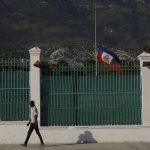 
              The Haitian flag flies at half-mast at the Presidential Palace in Port-au-Prince, Haiti, Saturday, July 10, 2021, three days after President Jovenel Moise was assassinated in his home. (AP Photo/Fernando Llano)
            