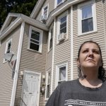 
              Roxanne Schaefer, of West Warwick, R.I., stands for a photograph outside of her apartment building, in West Warwick, Tuesday, July 27, 2021. Schaefer, who is months behind on rent, is bracing for the end to a CDC federal moratorium Saturday, July 31, 2021, a move that could result in millions of people being evicted just as the highly contagious delta variant of the coronavirus is rapidly spreading. (AP Photo/Steven Senne)
            