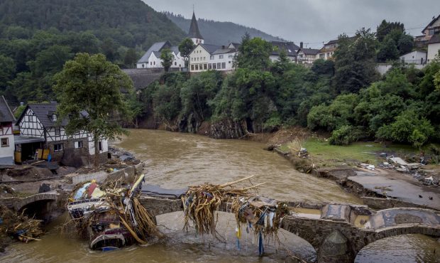 Debris hangs on a damaged bridge over the Ahr river in Schuld, Germany, Friday, July 16, 2021. Two ...
